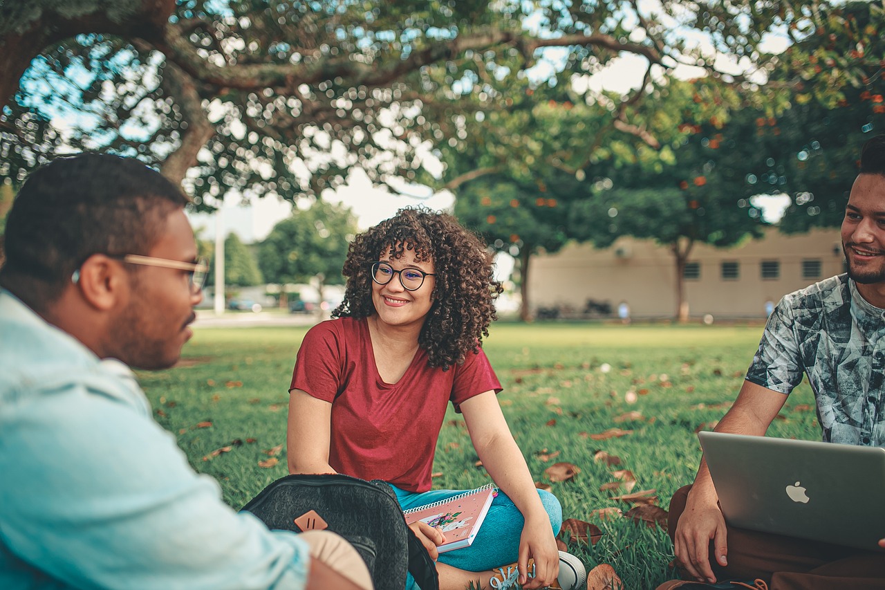 students sitting in the university garden